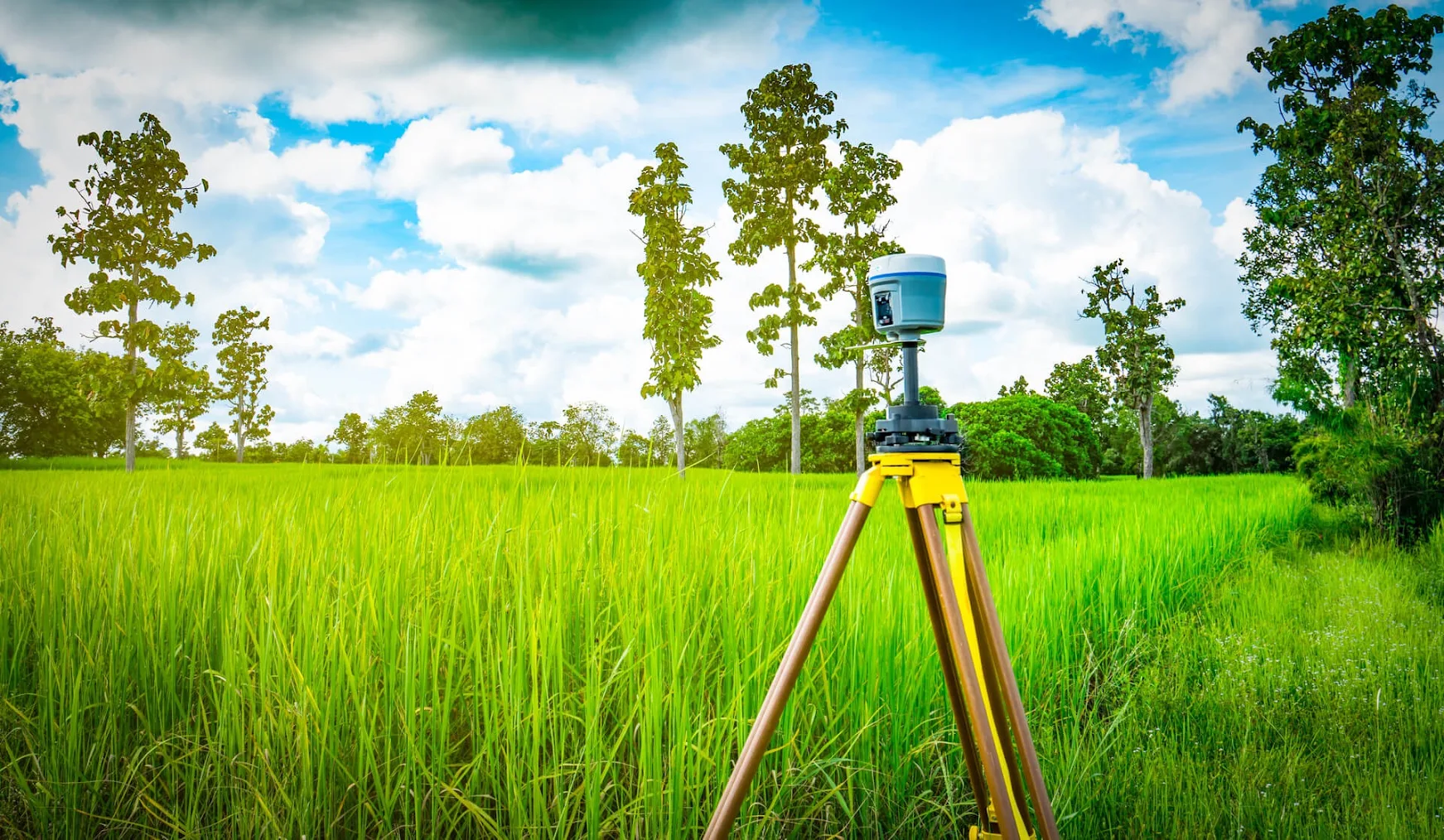 Land surveying equipment marking property boundaries.